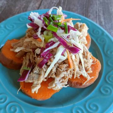 Pulled pork on sweet potato slices topped with shredded cabbage.