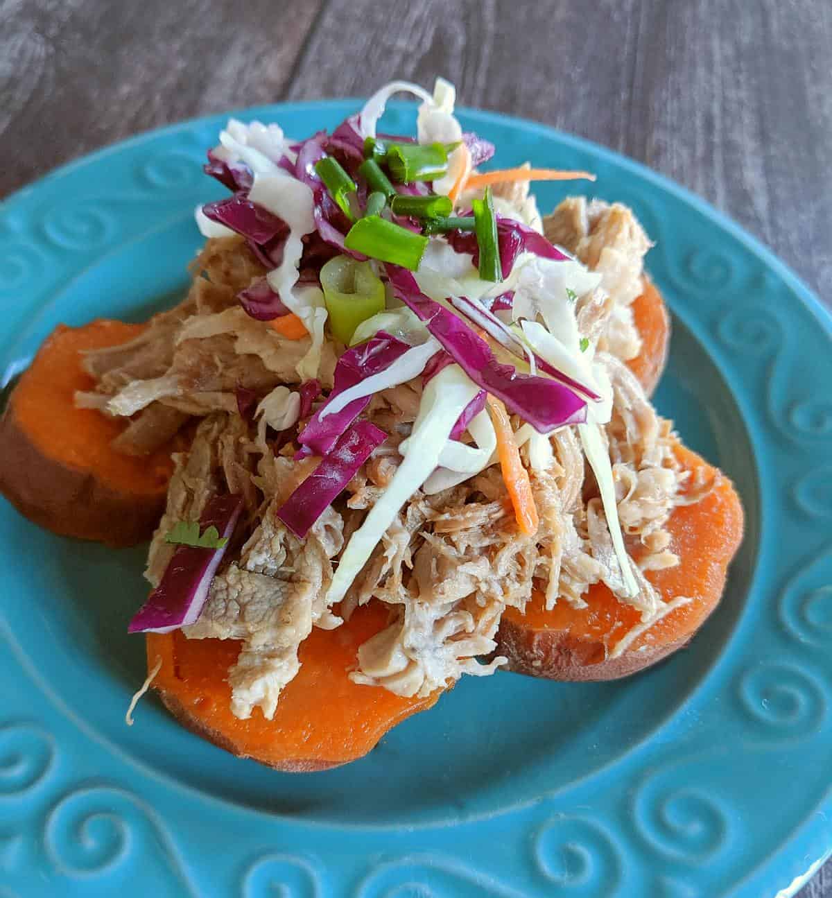 Pulled pork on sweet potato slices topped with shredded cabbage.
