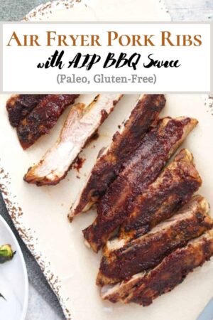pinterest pin with air fryer pork ribs with aip bbq sauce on a cream colored platter