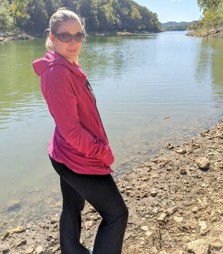 Arika standing in front of a lake.